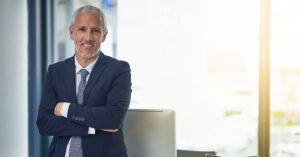 Blogs 19 Confident financial advisor in a professional office setting, representing Financial Gravity’s mission to empower advisors for growth and success.