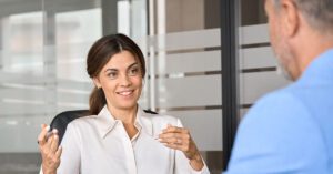 Blogs 2 Financial advisor confidently meeting with a client, representing how Financial Gravity’s Turnkey Multi-Family Office Charter gives advisors a compelling offer to present.