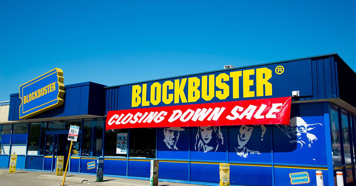 Blockbuster store with a "Closing Down Sale" banner, representing the risk financial advisors face if they fail to evolve—something Financial Gravity helps prevent.