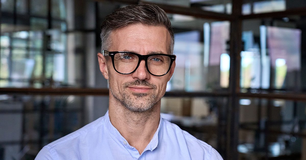 Confident advisor embracing reinvention through Financial Gravity’s modern solutions