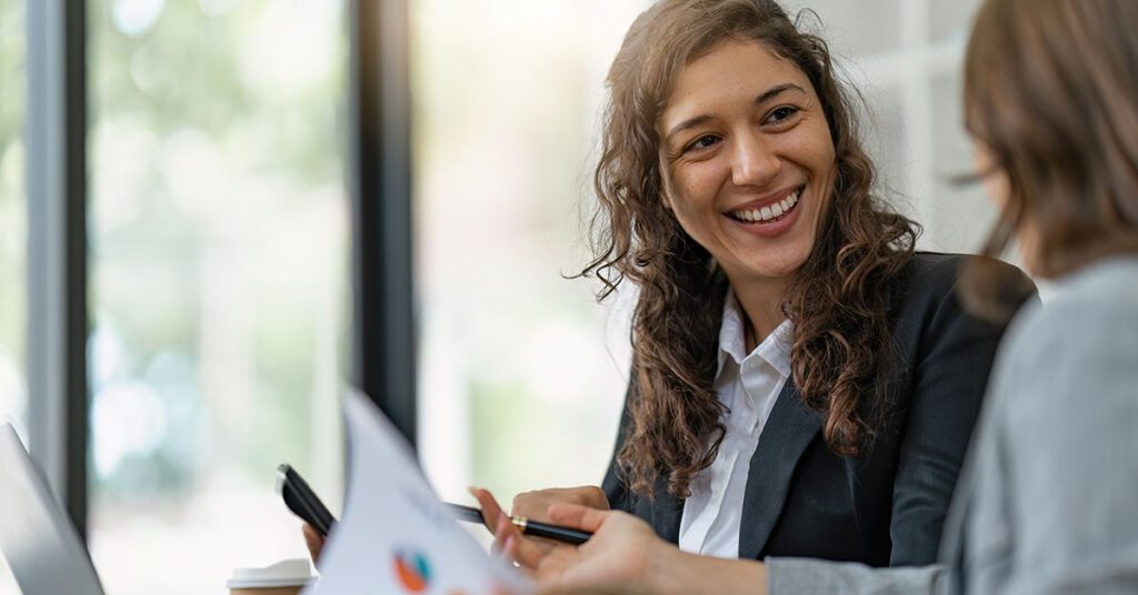 Independent financial advisor confidently collaborating with a client, symbolizing how Financial Gravity’s Turnkey Multi-Family Office Charter empowers advisors to stay independent while scaling through integrated tax, estate, and investment infrastructure.