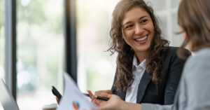 Independent financial advisor confidently collaborating with a client, symbolizing how Financial Gravity’s Turnkey Multi-Family Office Charter empowers advisors to stay independent while scaling through integrated tax, estate, and investment infrastructure.