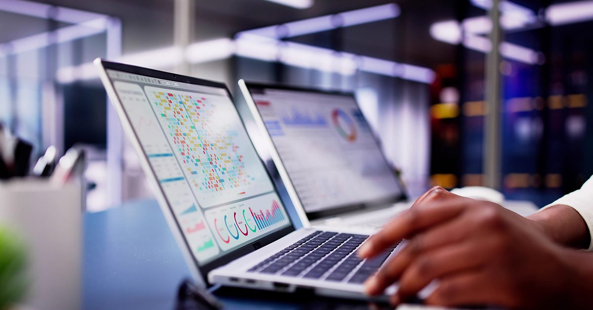 AI dashboards on a laptop support financial advisors with real-time insights during planning work.